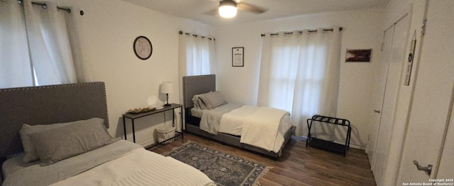 bedroom featuring dark wood-type flooring and ceiling fan