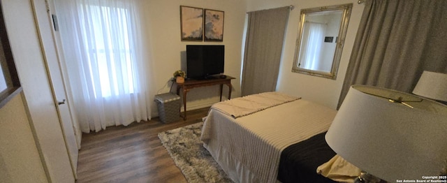 bedroom featuring dark hardwood / wood-style flooring