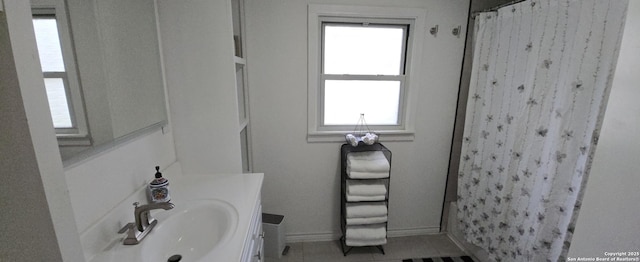 bathroom featuring tile patterned flooring and vanity