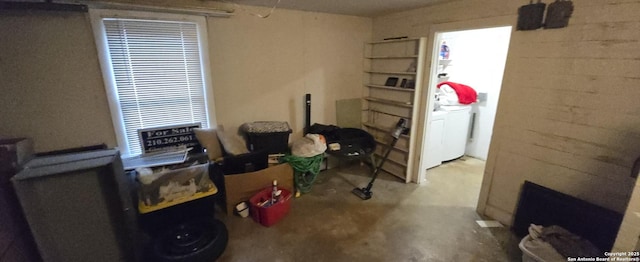 miscellaneous room featuring washer / clothes dryer and concrete flooring