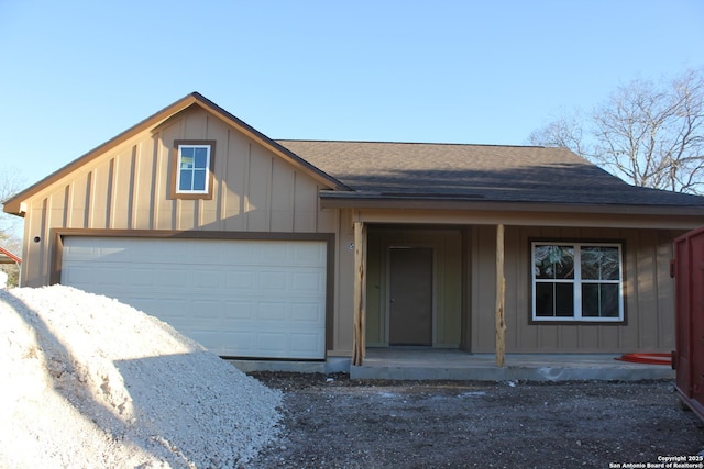 view of front of home featuring a garage and covered porch