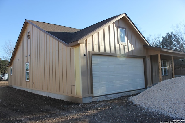 view of side of property featuring a garage