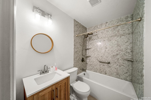 full bathroom with tiled shower / bath combo, vanity, and toilet