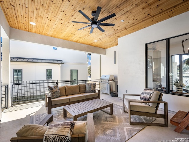 view of patio with outdoor lounge area and ceiling fan