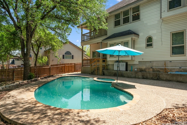 1219 Vista Del Juez, San Antonio, TX 78216 - view of swimming pool with a fenced backyard, a pool with connected hot tub, and a patio
