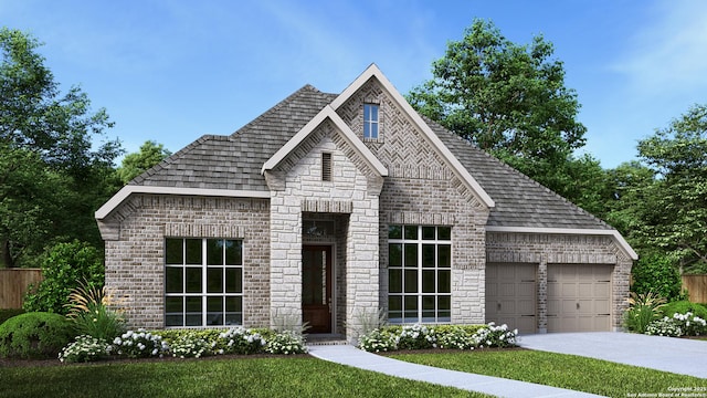 view of front of home featuring a garage and a front lawn