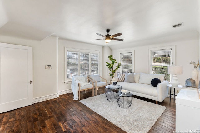 living room with dark hardwood / wood-style floors and ceiling fan