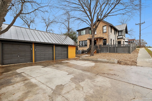 view of front of house featuring an outbuilding and a garage