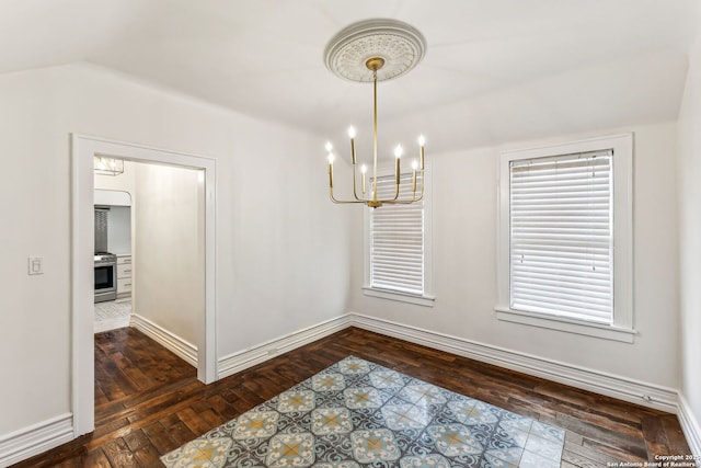 unfurnished dining area featuring dark hardwood / wood-style flooring and a chandelier