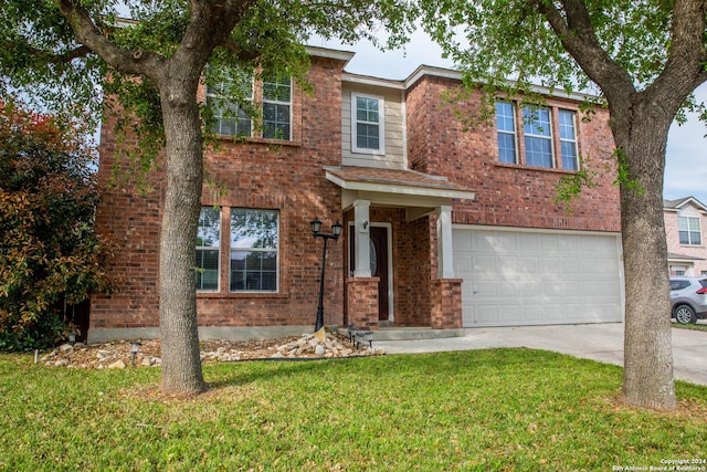 view of front facade with a garage and a front yard