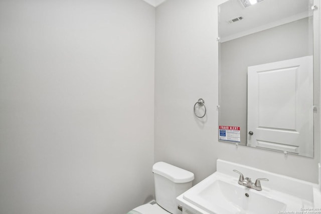 bathroom with sink and toilet