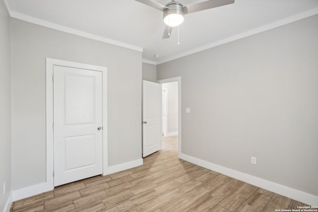 unfurnished bedroom with ornamental molding, ceiling fan, and light hardwood / wood-style floors