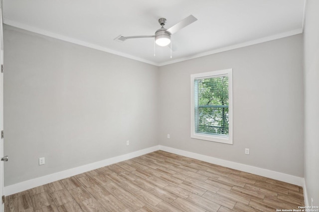 empty room featuring crown molding, ceiling fan, and light wood-type flooring