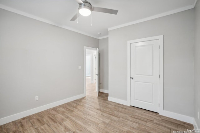 unfurnished bedroom with ornamental molding, light hardwood / wood-style floors, and ceiling fan