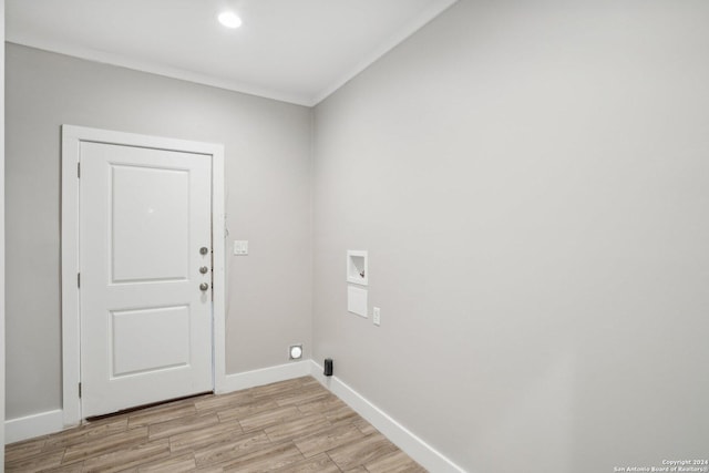 laundry area featuring crown molding, hookup for a washing machine, and light wood-type flooring