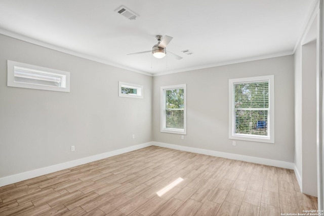 empty room featuring ornamental molding, light wood-type flooring, and ceiling fan