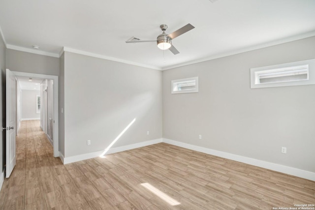 spare room with ornamental molding, ceiling fan, and light wood-type flooring