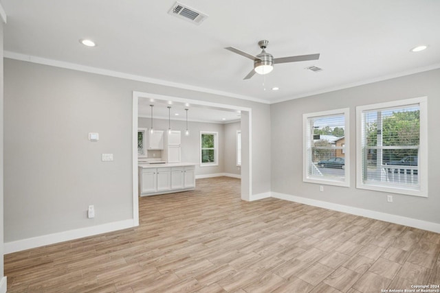 unfurnished living room featuring crown molding, ceiling fan, and light hardwood / wood-style floors