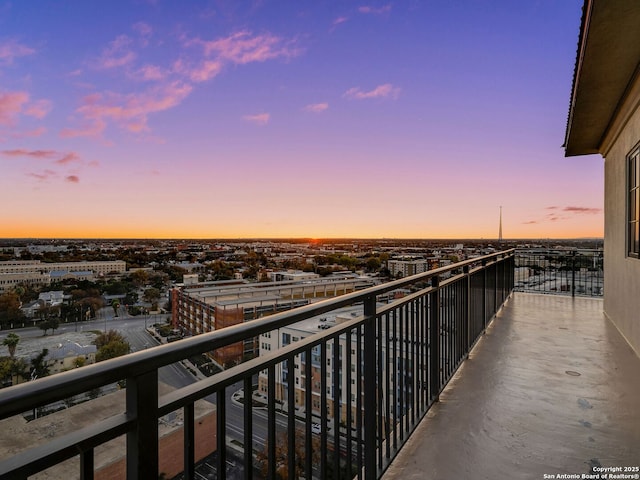 view of balcony at dusk