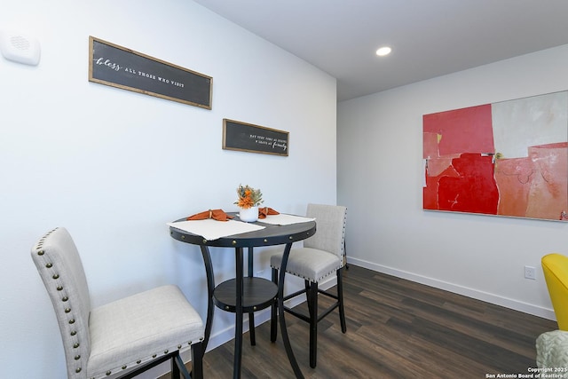 dining room with dark wood-type flooring