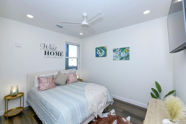 bedroom featuring dark hardwood / wood-style flooring and ceiling fan