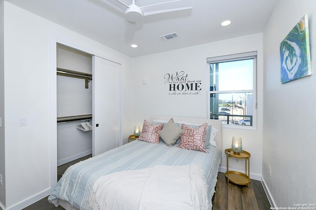 bedroom with ceiling fan, dark hardwood / wood-style flooring, and a closet