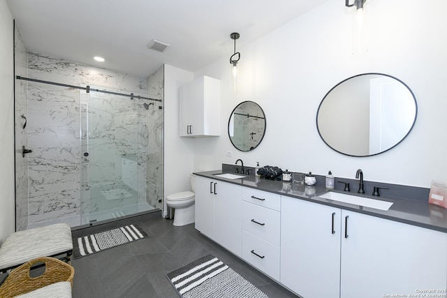 bathroom with vanity, toilet, and an enclosed shower