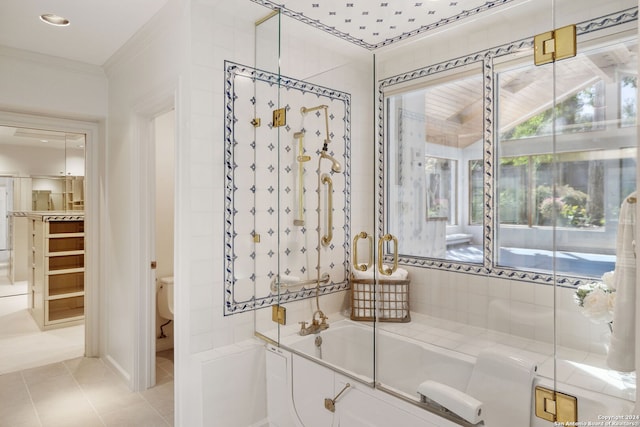 bathroom featuring crown molding, shower with separate bathtub, tile patterned floors, and toilet