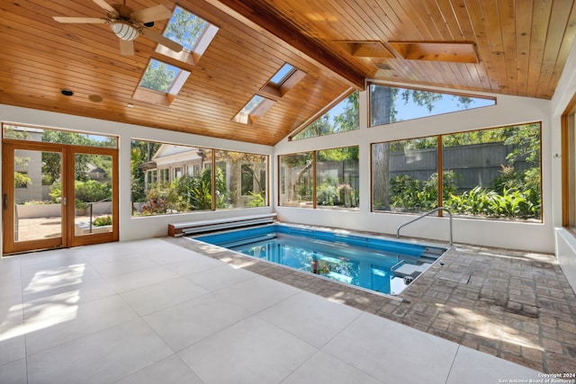 view of swimming pool with a skylight