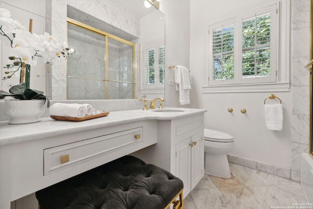 full bathroom featuring enclosed tub / shower combo, vanity, and toilet