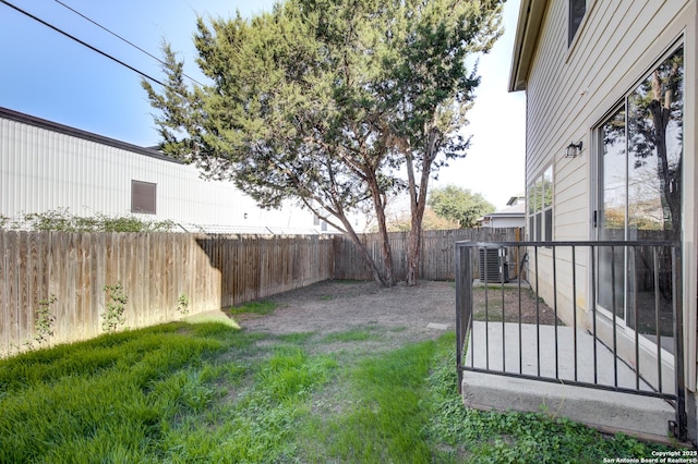 view of yard featuring central AC unit