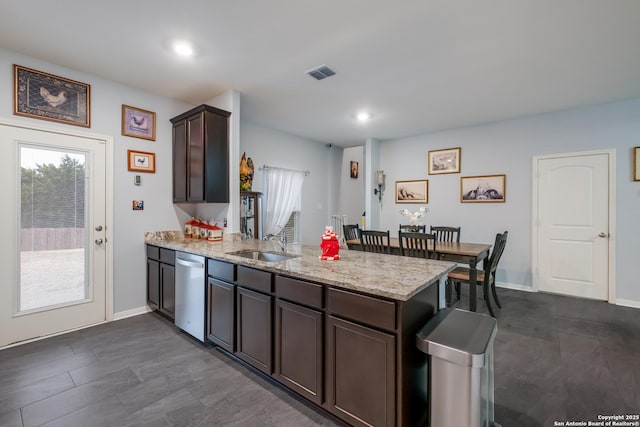 kitchen featuring sink, dark brown cabinets, kitchen peninsula, and dishwasher