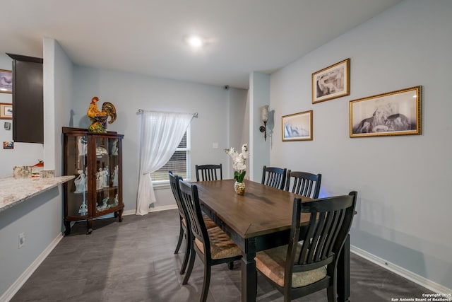 dining room featuring baseboards