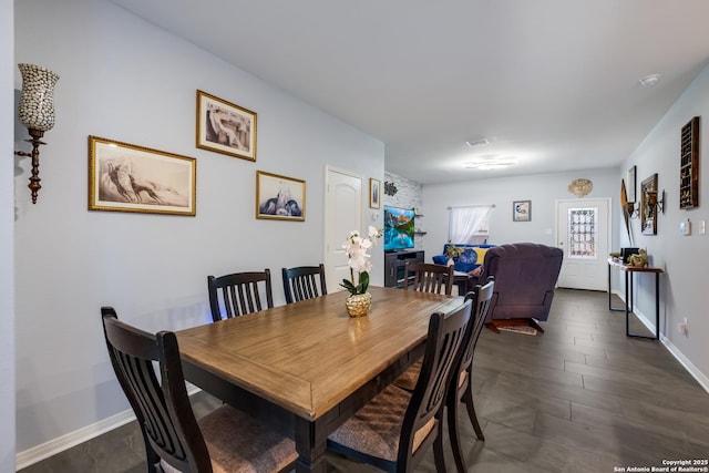 dining area featuring baseboards