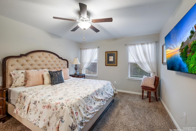 carpeted bedroom featuring multiple windows and ceiling fan