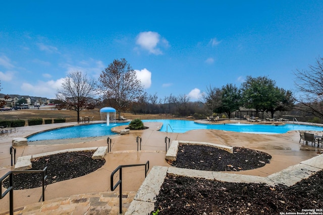 view of pool featuring a patio and pool water feature