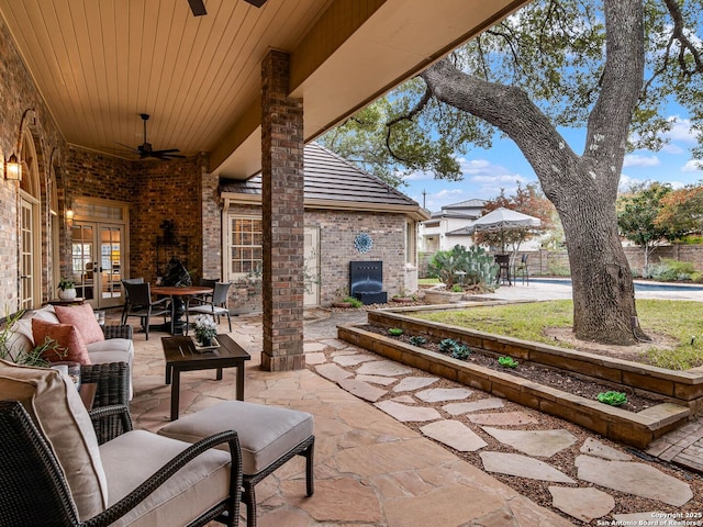 view of patio with french doors, ceiling fan, and an outdoor hangout area