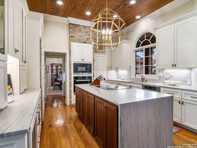 kitchen featuring black appliances, white cabinets, a kitchen island, decorative light fixtures, and wooden ceiling