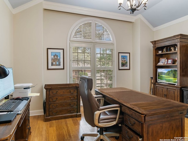 office space with ornamental molding, an inviting chandelier, and light hardwood / wood-style floors