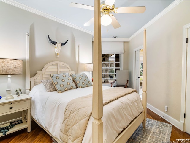 bedroom featuring dark hardwood / wood-style flooring, crown molding, and ceiling fan