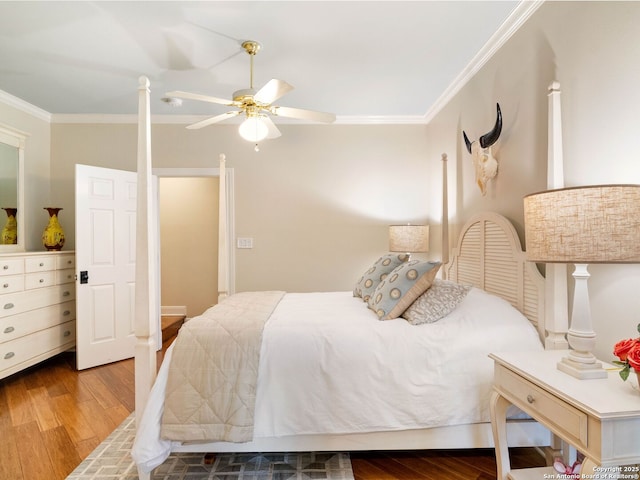 bedroom with crown molding, ceiling fan, and hardwood / wood-style flooring