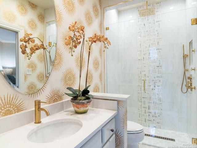 bathroom featuring an enclosed shower, vanity, and toilet