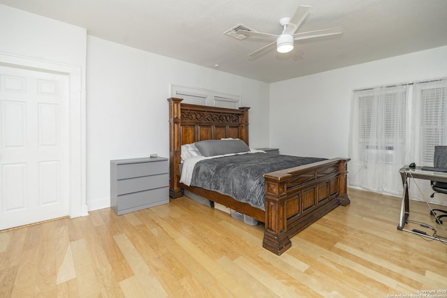 bedroom with ceiling fan and light hardwood / wood-style floors