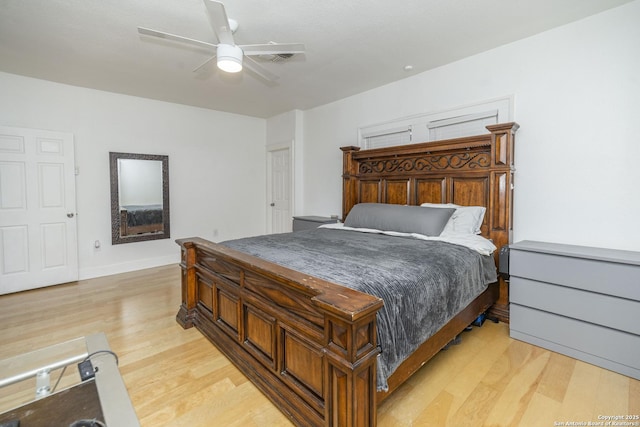 bedroom with ceiling fan and light hardwood / wood-style flooring