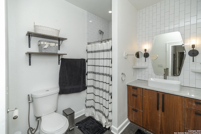 bathroom featuring toilet, a shower with curtain, vanity, tile patterned flooring, and decorative backsplash