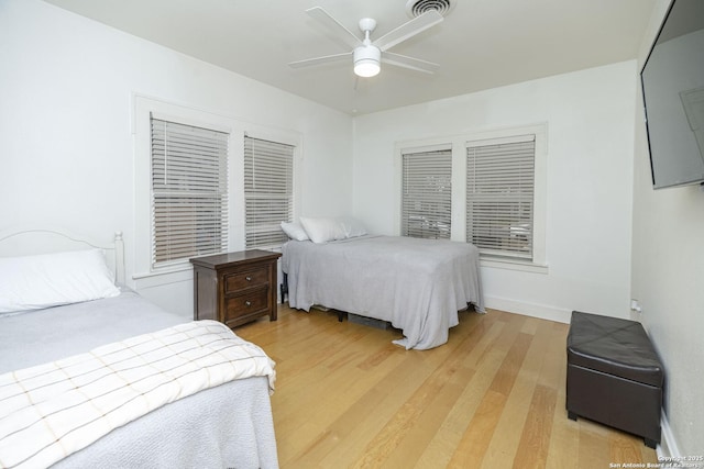 bedroom with hardwood / wood-style flooring and ceiling fan