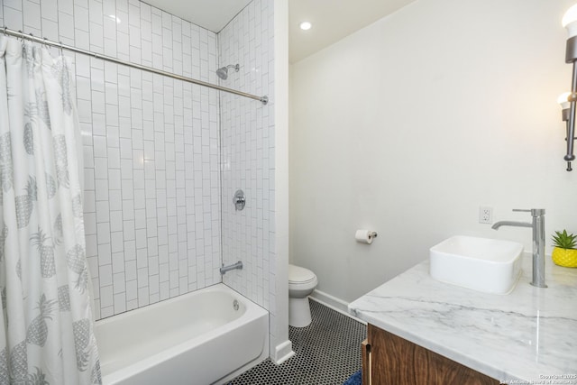 full bathroom featuring tile patterned flooring, vanity, shower / tub combo with curtain, and toilet