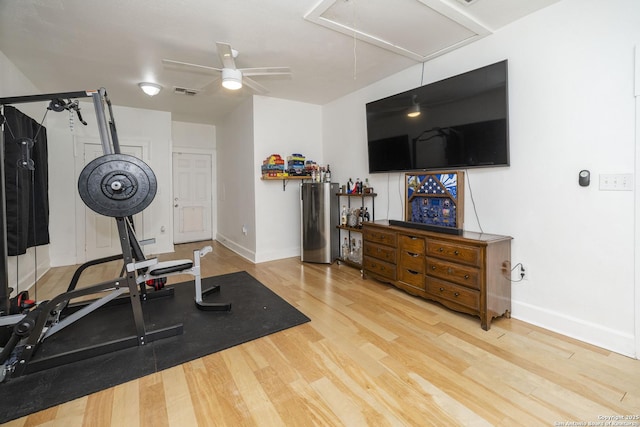 exercise room featuring hardwood / wood-style floors and ceiling fan