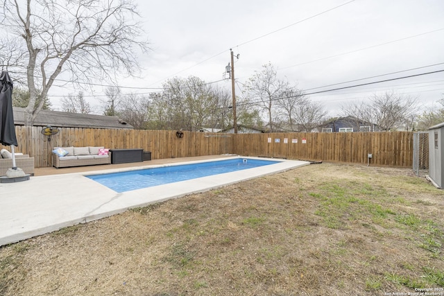 view of pool with outdoor lounge area, a patio, and a lawn