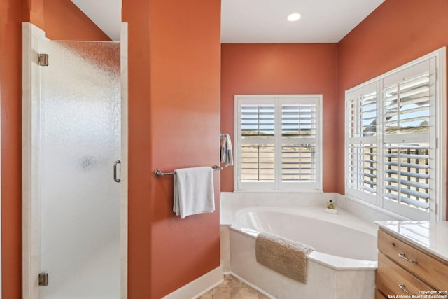 bathroom featuring vanity and plus walk in shower